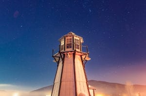 Lighthouse at Frisco Bay Marina with stars in the sky